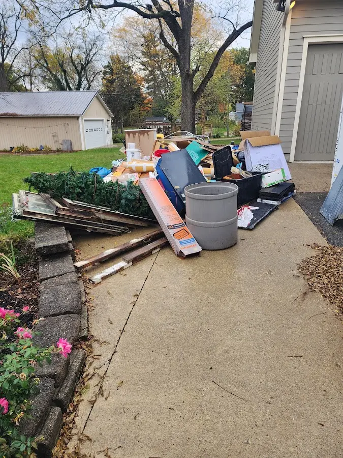 Dumpster being loaded with debris for 3 Yard Dumpster Rental in Peabody